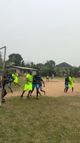 Soccer match played on dirt field in Ikot Ekpene