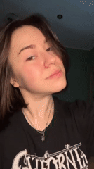 Woman documents evening skincare routine with cat in Odesa