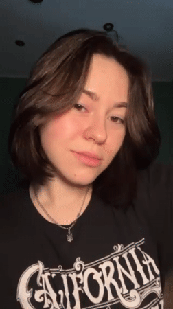 Woman documents evening skincare routine with cat in Odesa