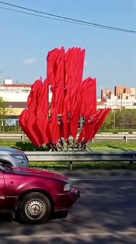 Red flags displayed along roadside in Voronezh, Russia