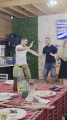 Dancing and dining at a casual indoor gathering in Varna