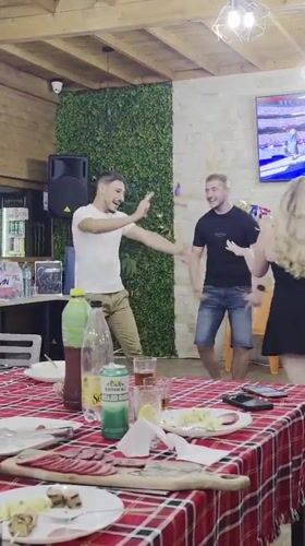 Dancing and dining at a casual indoor gathering in Varna