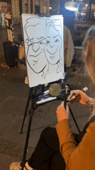 Street artist draws caricatures in Belgrade commercial district
