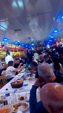 Evening scenes captured along illuminated Bosphorus in Sarıyer, Turkey