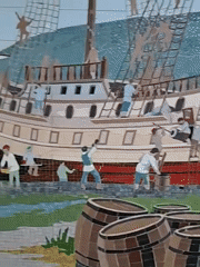 Large historical murals spanning maritime and winter battle scenes