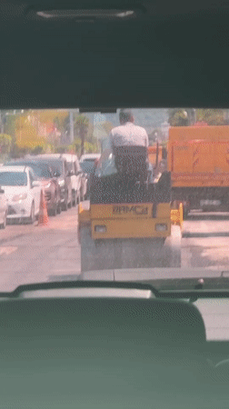 Road paving and street traffic in sunny Fethiye