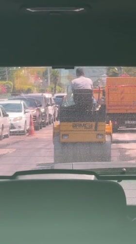 Road paving and street traffic in sunny Fethiye