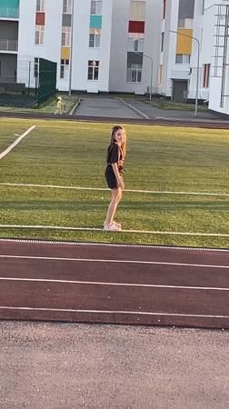 Girl performs backbend on athletic field in Saratov