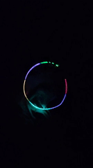 Person plays with colorful light accessories in Chelyabinsk evening