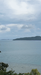 Peaceful island seascape captured from elevated viewpoint in Thailand