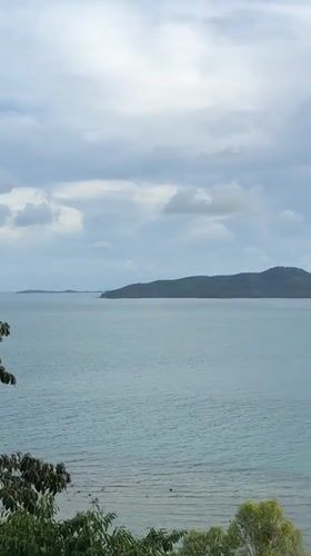 Peaceful island seascape captured from elevated viewpoint in Thailand