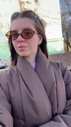 Woman records selfie video in early morning Klin