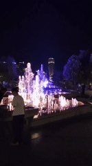 Colorful fountain lights up Yerevan public square at night