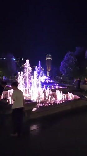Colorful fountain lights up Yerevan public square at night
