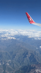 Turkish Airlines passenger films mountain views over Montenegro