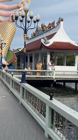 Morning visit to Wat Plai Laem's statues, shrines, and temple cats