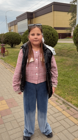Young women visit stadium and church in Novopokrovskaya, Russia