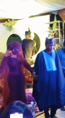 Wedding ceremony with traditional attire observed in decorated hall