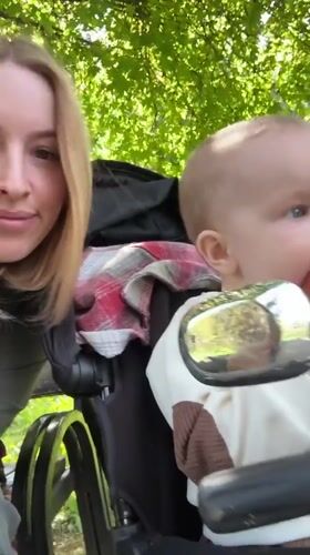 Mother films casual park outing with baby in Donetsk