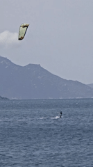 Morning beach scene with kitesurfing and leisure activities in Nha Trang