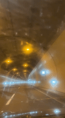 Vehicle passes through illuminated tunnel in Bátaszék, Hungary