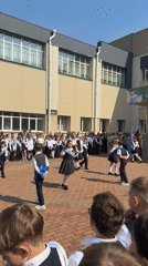 School children perform dance for audience in Birobidzhan