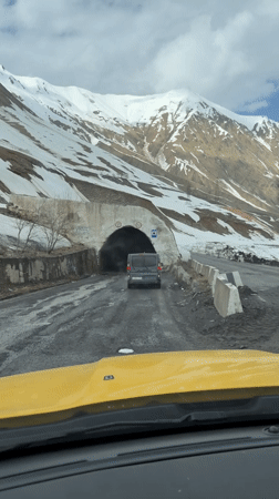 Driver follows van through Georgian mountains, enters tunnel
