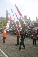 Gamelan music and flag ceremonies mark a civic gathering in Demak