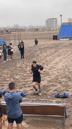 Outdoor fitness competition on Arica's sandy beach arena