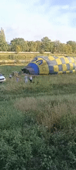 Hot air balloon launches over Opole's riverside fields