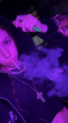 Night smoking scene captured under colored lighting in Buenos Aires