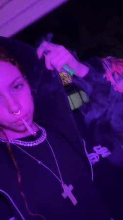 Night smoking scene captured under colored lighting in Buenos Aires