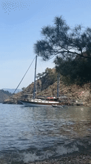 Two-masted sailboat anchored in Fethiye bay on sunny morning