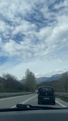Highway travel through snowy Italian mountains documented by motorists