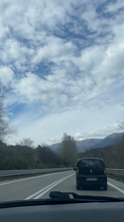 Highway travel through snowy Italian mountains documented by motorists