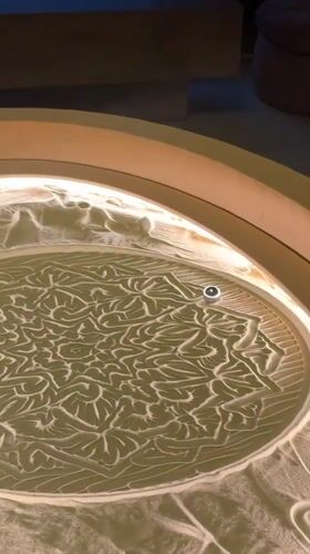 Tea service and sand art table captured at Khimki establishment