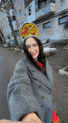 Woman films herself walking in decorative headdress