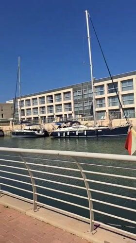 Morning at Herzliya Marina, boats docked on a calm clear day
