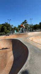 Scooter rider practices tricks at Barcelona skatepark