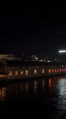 Geneva waterfront building lit up at night