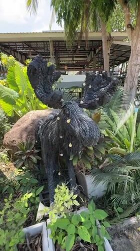 Animal sculptures spotted in Thai garden setting