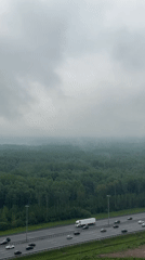 Morning highway traffic observed from above in Kudrovo, Russia