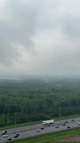Morning highway traffic observed from above in Kudrovo, Russia