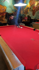 Late night pool game observed at Vicente López bar