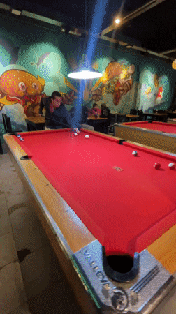 Late night pool game observed at Vicente López bar