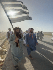 Men march in daytime procession in Pishin, Pakistan