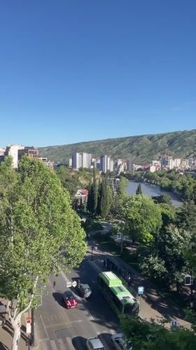 Afternoon cafe visit documented with city views in Tbilisi