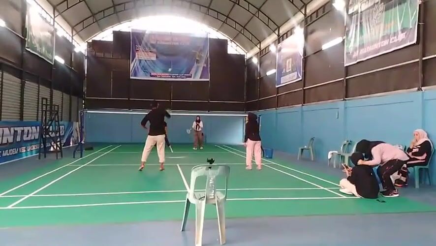 Badminton session in full swing at an indoor court in Aceh