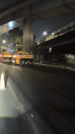 Night paving operation in full swing under West Jakarta flyover