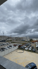 Overcast morning over a Tbilisi construction site and parking lot